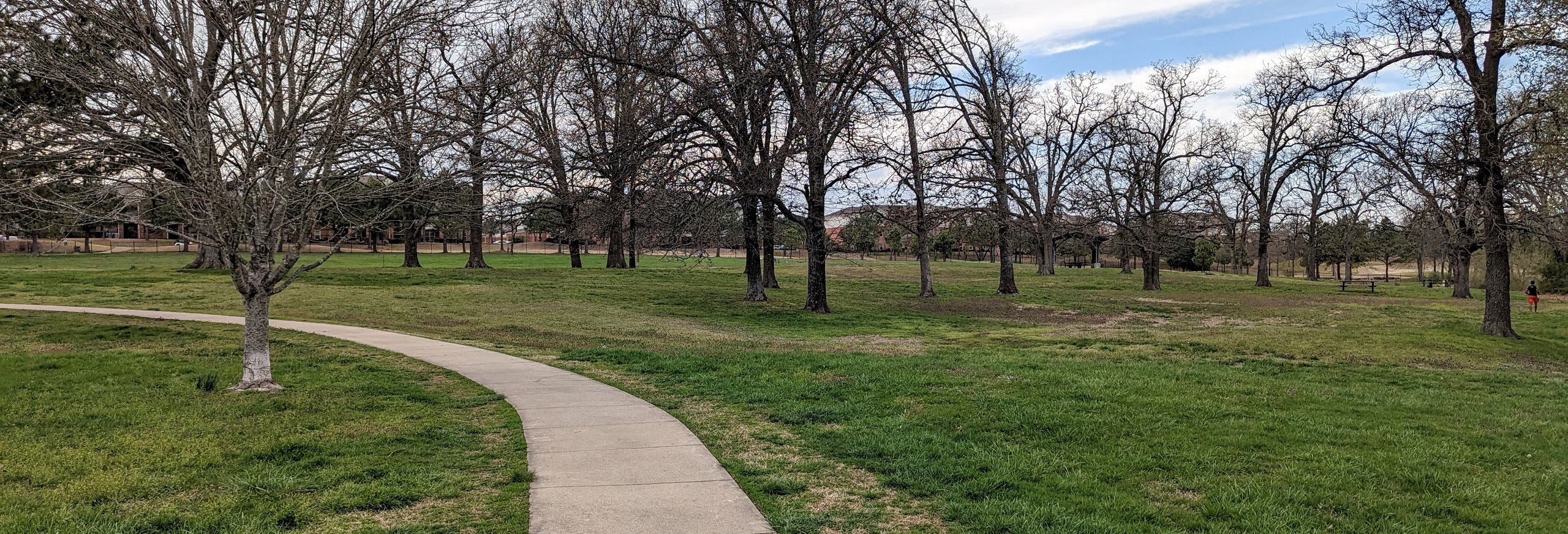 A paved trail that runs by the dog park found at Bryce Davis Park.