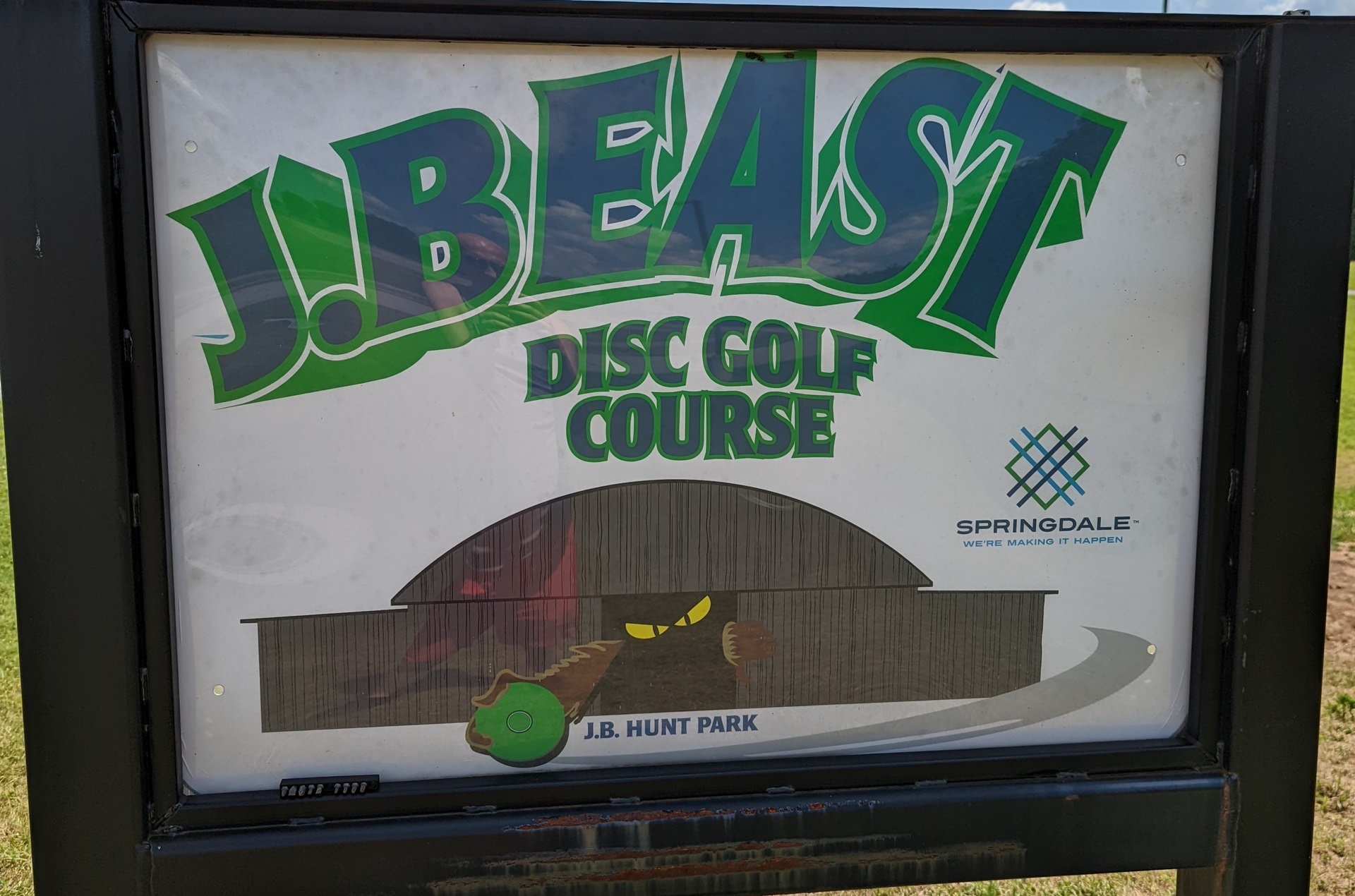 The main sign posted at the start of the course. Features big bold letters and a clever beast design.